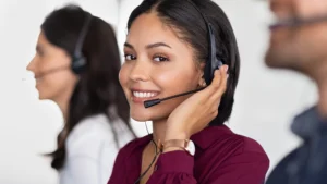 Offshore support team members wearing headsets in an office, working under managed security and access controls